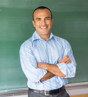 Teacher in front of a blackboard